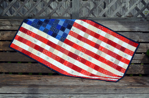 Scrappy, patchwork, American Flag quilted wall hanging